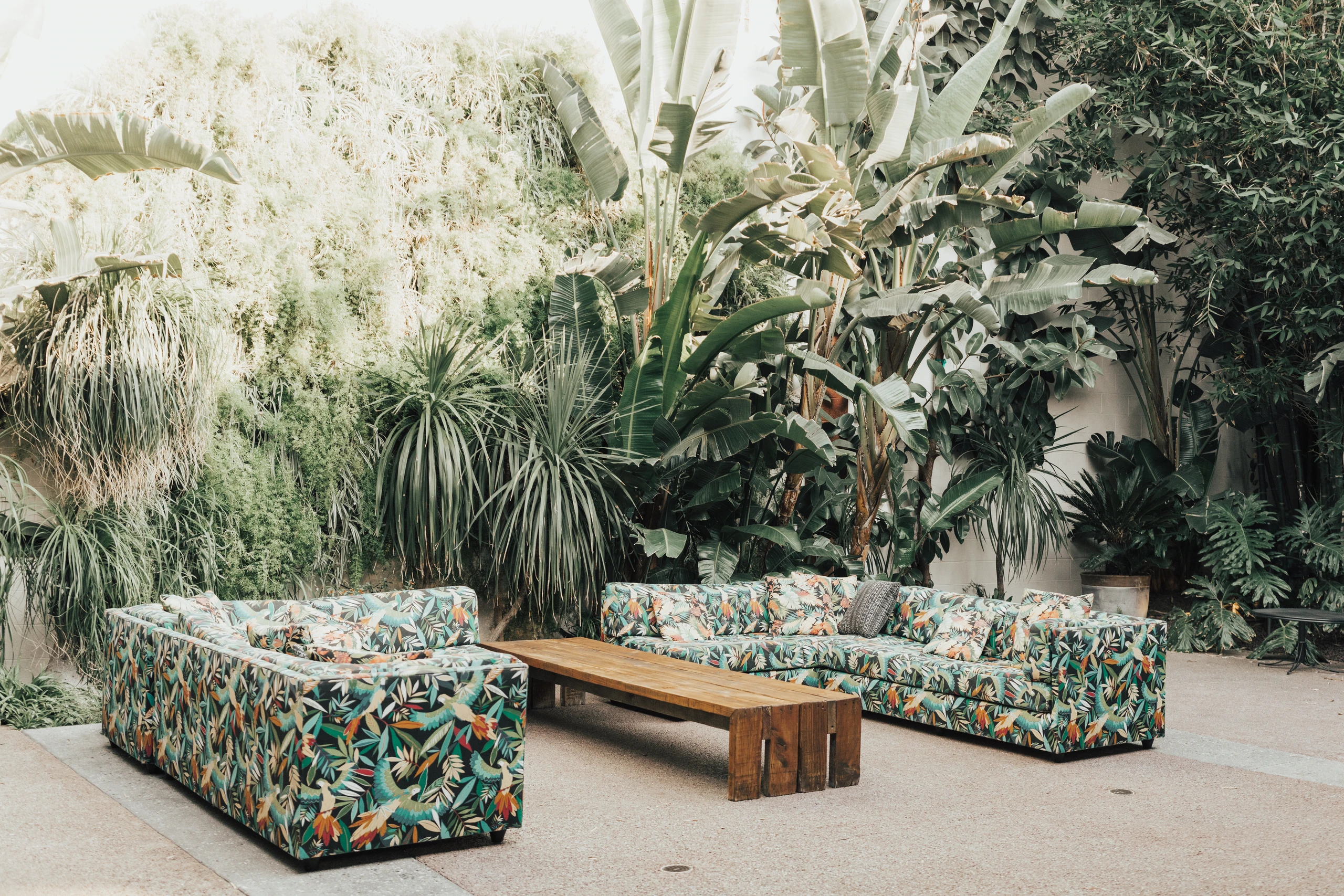 Millwick’s courtyard lounge beneath mature greenery